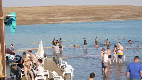 Group-of-people-floating-on-water-in-the-Dead-Sea-in-Israel