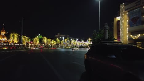Night-POV-driving-on-Phan-Fa-Lilat-Bridge-by-Queen's-Gallery,-Bangkok