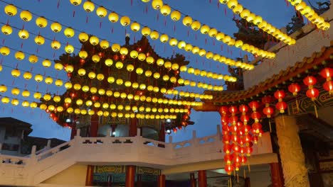 Dolly-up-view-of-Thean-Hou-Temple-adorned-with-yellow-lanterns,-which-are-believed-to-represent-good-luck,-prosperity,-and-happiness-for-the-birthday-celebration-of-Mazu-in-Kuala-Lumpur,-Malaysia