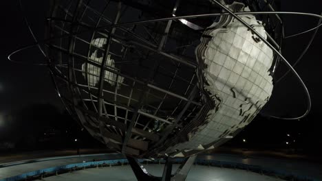 An-aerial-view-of-the-iconic-Unisphere-in-Flushing-Meadows-Corona-Park-on-a-cloudy-night
