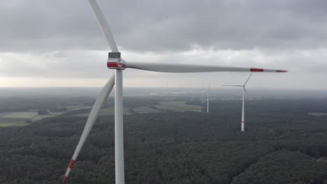 Descent-drone-shot-of-wind-turbines-in-the-landscape