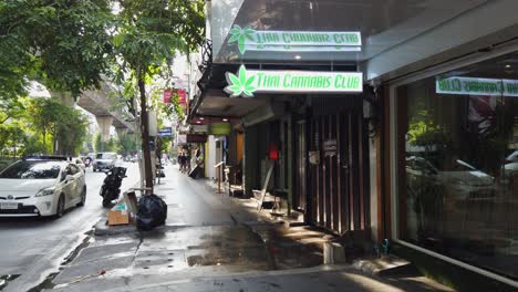 Thai-Cannabis-Club-sign-illuminated-at-shop-on-Bangkok-side-street