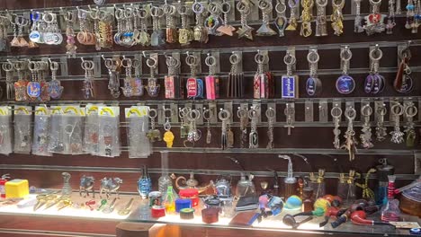 pan-shot-of-small-boutique-shop-on-streets-of-Egypt-meant-for-tourists,-lot-of-different-type-of-water-pipes