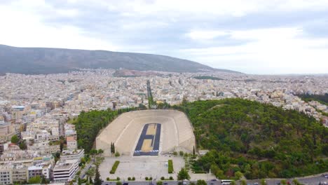 Aerial-View-Of-Panathenaic-Stadium,-Kallimarmaro-And-Ardittos-Hill-In-Pangrati,-Athens,-Greece