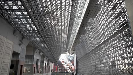 Tilt-Down-Shot-From-Intricate-Roof-Structure-Of-Kyoto-Station-To-Reveal-Enormous-Atrium