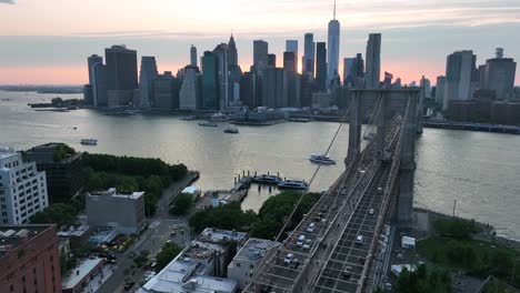 Aerial-establishing-shot-of-Brooklyn-Bridge-and-American-flag-waving
