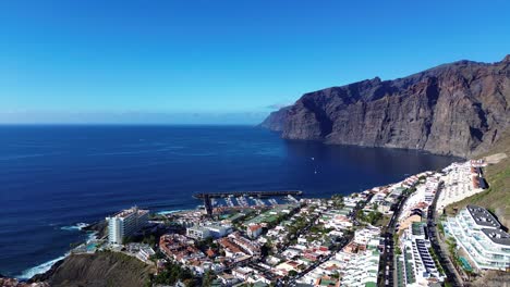 Los-Gigantes-aerial-in-Tenerife,-Canary-Island-Spain-of-port,-resort-town-with-hotel