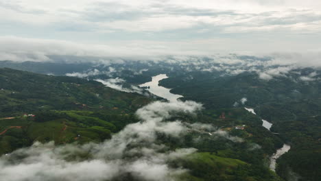Aerial-view-over-low-hanging-clouds-in-the-highlands-of-Antioquia,-Colombia