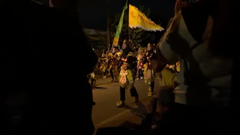Takbir-parade-or-festival,-an-event-to-welcome-Eid-al-Fitr-or-Eid-al-Adha,-carrying-lanterns-and-wearing-unique-costumes-and-pronouncing-the-symbols-of-Allah