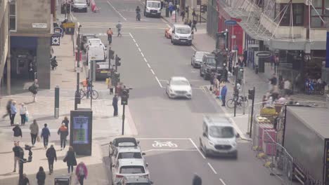 Time-lapse-of-people-and-vehicles-on-Buchanan-Street-Glasgow,-locked-off