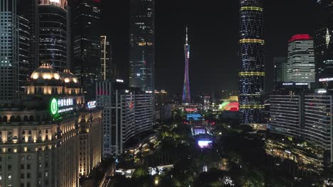 Guangzhou-downtown-Huacheng-park-area-with-office-buildings-and-Canton-Tower-landmark-in-the-distance-in-the-evening