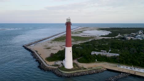 A-4K-drone-shot-of-the-Barnegat-Lighthouse,-located-on-the-northern-tip-of-Long-Beach-Island-in-Ocean-County,-New-Jersey,-U