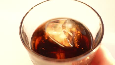 Cola-drink-with-ice-cubes-inside-crystal-clear-glass-isolated-on-white