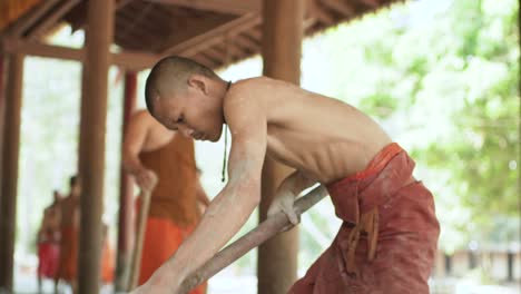 1-Young-buddhist-monks-working-and-building-a-monastery-at-Angkor-Wat---Siem-Reap,-Cambodia