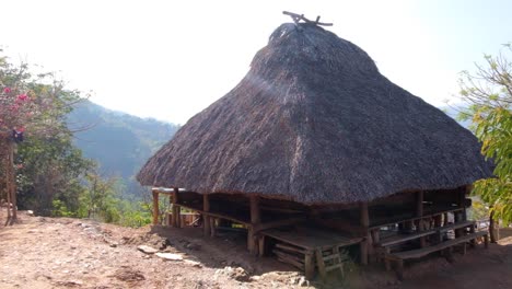Traditional-cultural-thatched-roof-house-in-rural-countryside-landscape-of-Timor-Leste,-Southeast-Asia