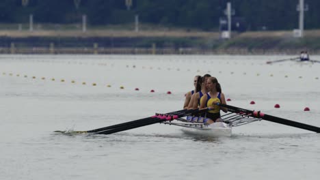 The-women-rowers-are-slowly-making-their-way-to-the-start-of-the-quadruple-sculls-race