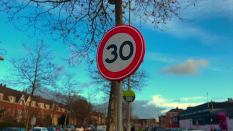 Amsterdam-30-kilometer-per-hour-restriction-sign-on-street-with-blue-sky