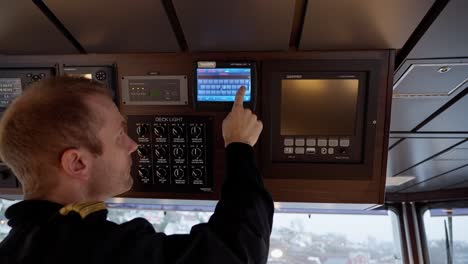 Worried-ship-captain-enters-Tel-Aviv,-Israel-into-ship-AIS-navigation-system