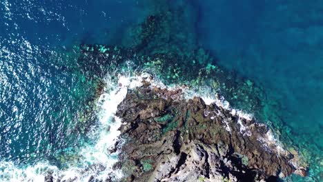 Aerial-coastline-with-sea-waves-on-volcanic-island-Tenerife-Canary-Islands,-Spain