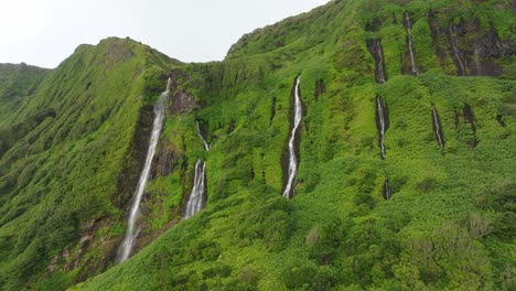 Drone-filming-multiple-waterfalls-at-Flores-island-in-Azores,-aerial