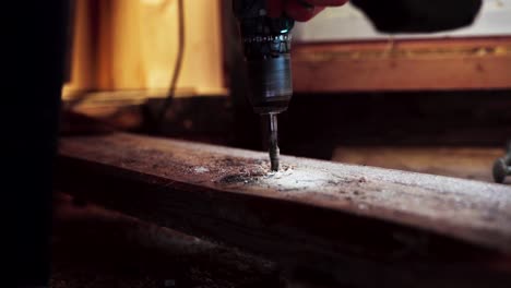Person-Drilling-Hole-On-Wood-Planks-Using-Power-Drill