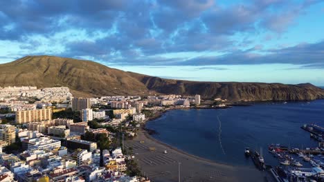 Playa-De-Las-Vistas-Volcanic-Sand-Beach-Los-Cristianos,-Tenerife-Costa-Adeje-Aerial