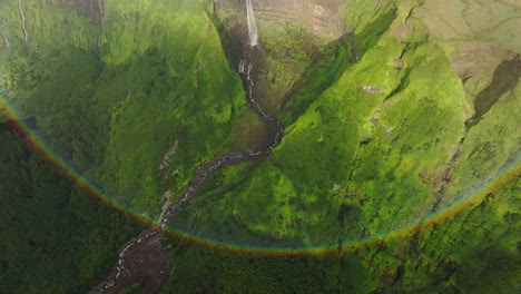 Amazing-rainbow-at-waterfall-Cascata-da-Ribeira-Grande-in-azores-island,-aerial