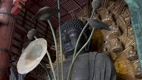 Looking-Up-At-The-Great-Buddha-In-The-Main-Hall-At-Todaji-Through-Artistic-Metal-Flower-Petals