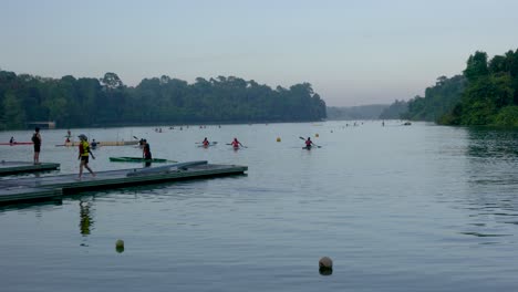Students-practicing-canoeing-and-kayak-against-the-background-of-a-beautiful-serene-view-in-Macritchie-Reservoir-in-Singapore