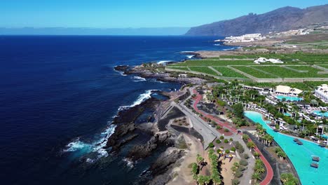 Barcelo-Santiano-hotel-aerial,-Los-Gigantes-Tenerife-coast-in-Canary-Islands,-Spain