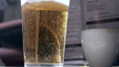 slow-motion-of-macro-shot-of-beer-drink-bubbling,-close-up