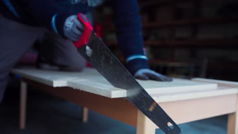 Carpenter-Cutting-Firebrick-Using-Hand-Saw