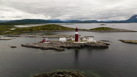 Tranoy-Lighthouse-With-Sea-And-Mountains-In-The-Background-In-Nordland-County,-Norway