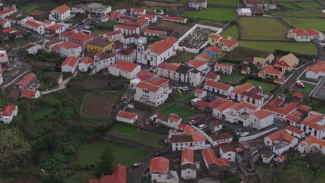 Drone-shot-tilting-away-from-Fajã-Grande-at-Flores-Azores-at-sunset