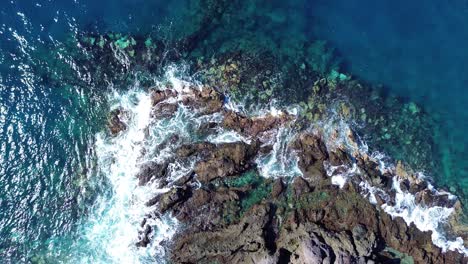 Aerial-coastline-with-sea-waves-on-volcanic-island-Tenerife-Costa-Adeje,-Spain