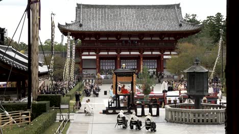Courtyard-View-From-Great-Buddha-Hall-Of-The-Grand-Memorial-Service-Being-Performed-With-Todai-ji-Chumon-In-Background