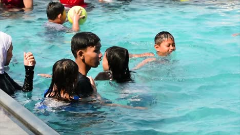 Family-vacation-by-swimming-in-hotel-swimming-pools-and-restaurants-at-tourist-attractions-in-Cirebon,-West-Java,-Indonesia-in-the-summer-during-the-Christmas-and-New-Year-holiday-season