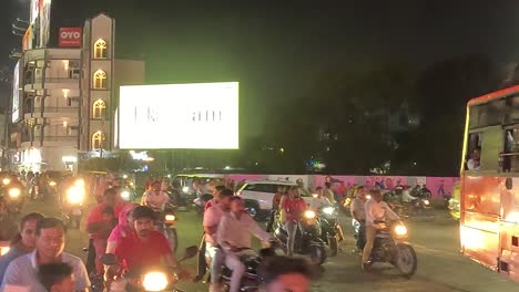 A-cinematic-sot,-a-night-scene-where-two-wheel-bikes-are-seen-in-abundance-on-the-road-in-Rajkot-city