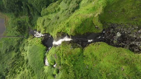 Above-Poço-Ribeira-do-Ferreiro-waterfall-at-Flores-island-Azores,-aerial