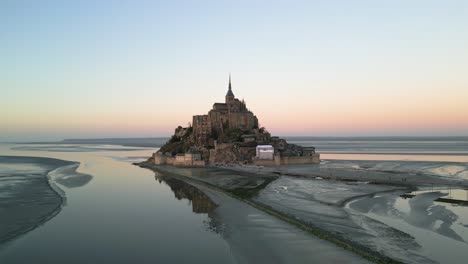 French-Ocean-Castle,-Mont-Saint-Michel-Cathedral,-Normandy-France-Sunset,-Aerial-Drone-Trucking-Right-to-Left-Establishing-Shot