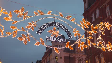At-Christmas-the-Marylebone-village-sign-hangs-above-the-street