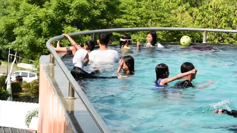 Family-vacation-by-swimming-in-hotel-swimming-pools-and-restaurants-at-tourist-attractions-in-Cirebon,-West-Java,-Indonesia-in-the-summer-during-the-Christmas-and-New-Year-holiday-season
