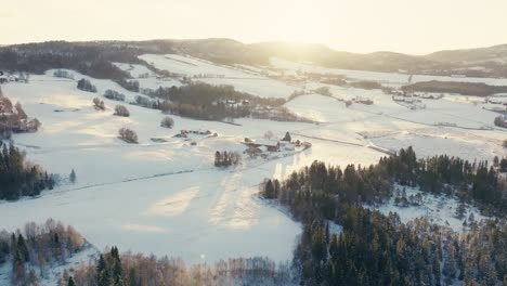 Bright-Morning-Sun-Shining-Over-The-Snowy-Landscape-and-Norwegian-Village-In-Winter