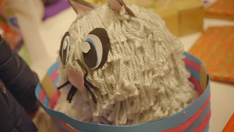 Fluffy-kitten-made-out-of-wool-close-up-handmade-hobby-craft