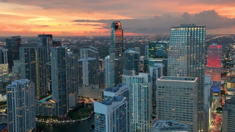 Evening-in-Miami,-with-a-breathtaking-aerial-view-capturing-iconic-buildings-and-busy-avenue-traffic
