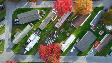 Manufactured-homes-in-USA-trailer-park-with-bright-colorful-autumn-foliage-on-trees-in-fall
