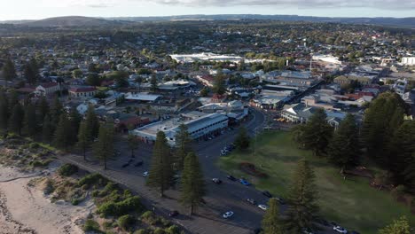 Aerial-of-Victor-Harbor-town-and-beach-at-sunset,-South-Australia
