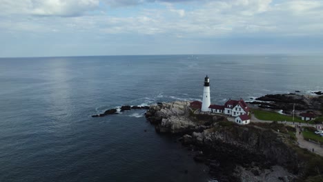 Portland-Head-Light-Lighthouse-on-Calm-Rocky-Maine-Coastline,-Aerial