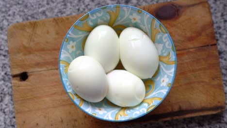 Top-View-Of-Whole-Hard-Boiled-Eggs-In-A-Bowl-In-The-Kitchen