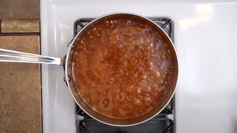 Top-down-down-view-of-sauce-simmering-on-the-stove---chana-masala-series